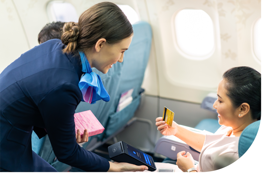 Passenger making a payment in-flight Shift4