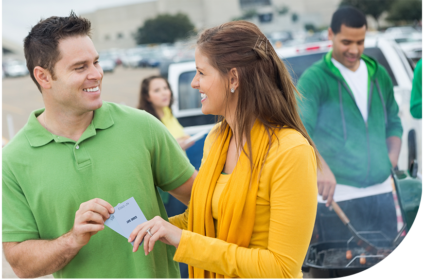 couple leaving parking lot after paying at event